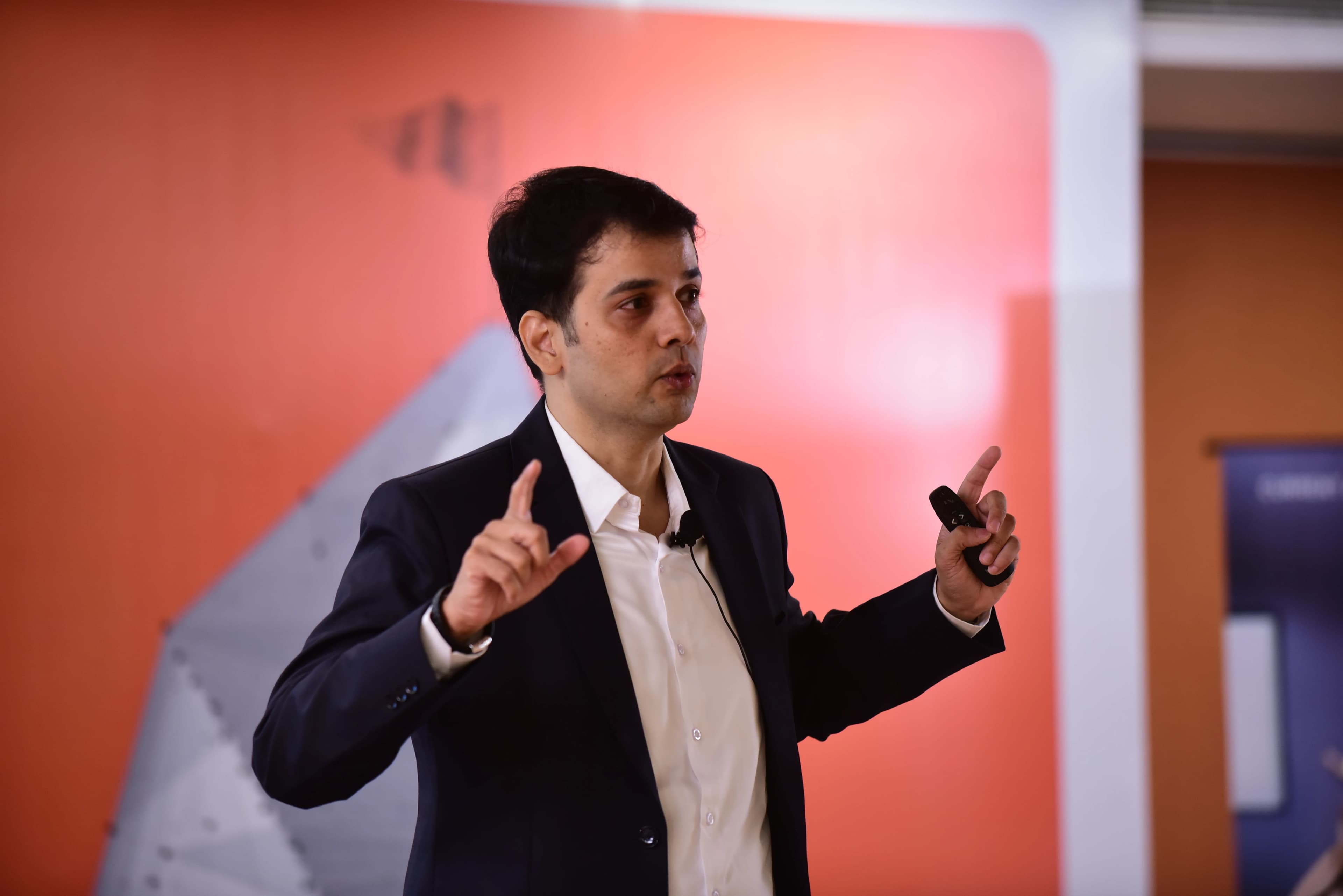 Vijay Sheshadri speaking at a conference